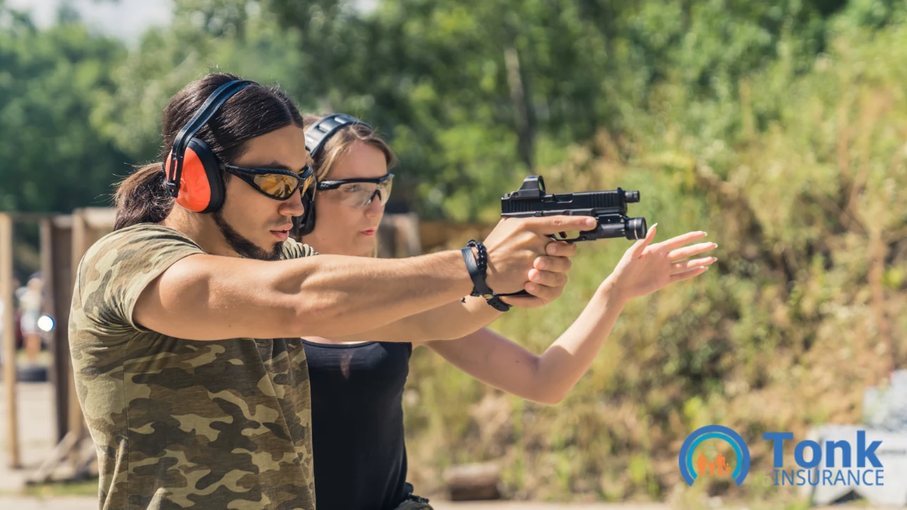 Firearms instructor guiding a student's aim at an outdoor shooting range, both wearing ear and eye protection